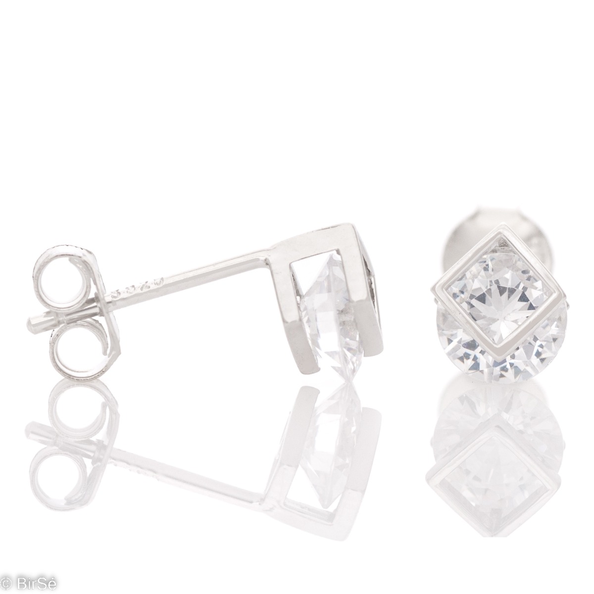 Charming and delicate women's earrings with exquisitely cut round zircon and a case of rhodium silver. The fastening is with a pin. Suitable for both ladies and small children. Earrings are a beautiful proposal for a gift to a beloved woman.