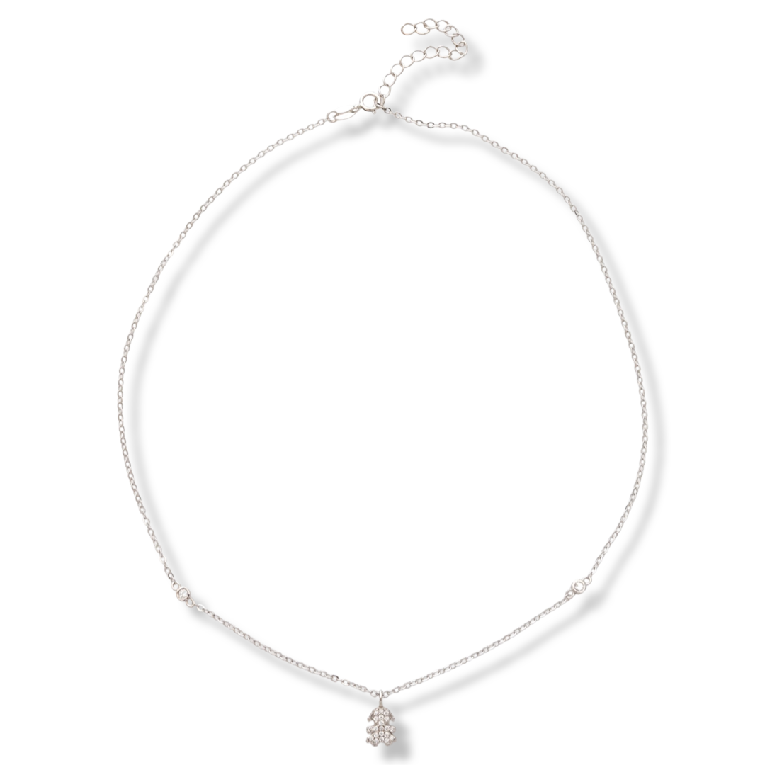 A charming delicate necklace in fine silver with a design of a little girl, studded with countless glittering zircons. The necklace is a suitable gift for a young girl or a mother of a newborn baby girl.