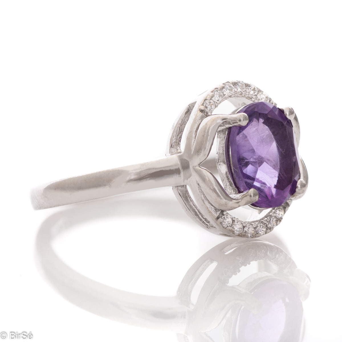 An elegant women's ring, shaped in oval elements and a gentle, beautiful look. Stylish craftsmanship from a fine combination of rhodium silver, zircons and natural amethyst. Complete with the same model of charming English clasp earrings.