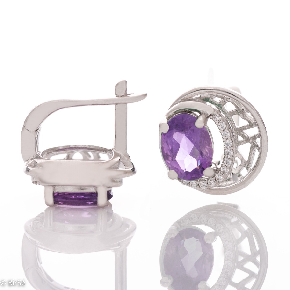 Elegant silver earrings with a modern look and English clasp. Stylish designer craftsmanship from a fine combination of rhodium-plated silver with captivating natural amethyst. Complete with silver pendant and silver ring from the same collection.