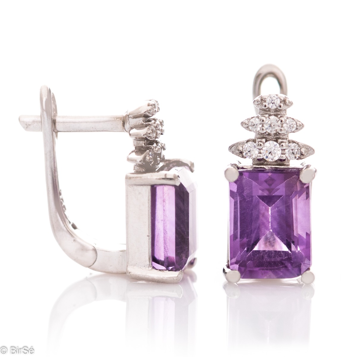 A fairy tale magic – delicate earrings made of rhodium silver with an English clasp. A combination of natural amethyst baguette and zircons in an elegant design.