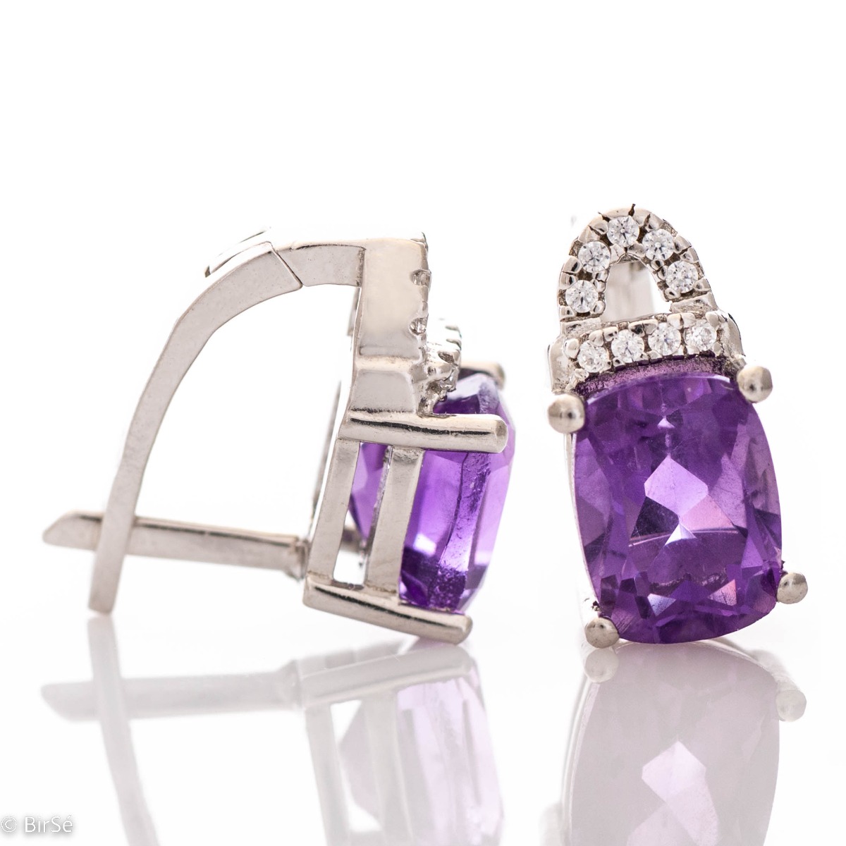 Elegant women's earrings with English clasp and precision craftsmanship entirely of rhodium-plated silver, combined with radiant natural amethyst and sparkling zircons. They can be combined with a ring and pendant of the same model.