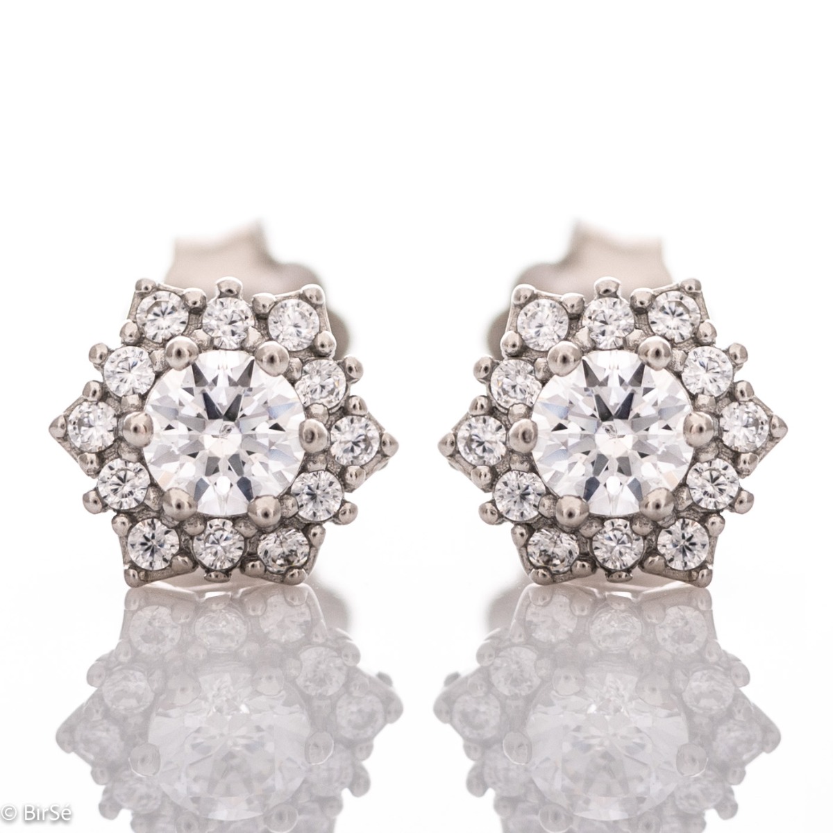 Finely crafted delicate earrings with a charming design. Made entirely of rhodium-plated sterling silver with a captivating shape and glittering zircons for total opulence.