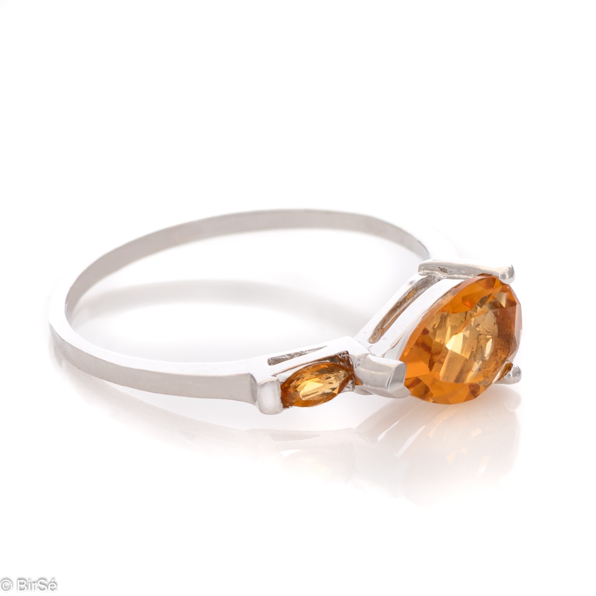 The golden glow of a natural citrine stone, complimented by a glamourous, exquisite and fine craftsmanship made entirely of beautiful rhodium silver - our new offering for women's ring, part of a charming set with a pendant and dangle earrings.