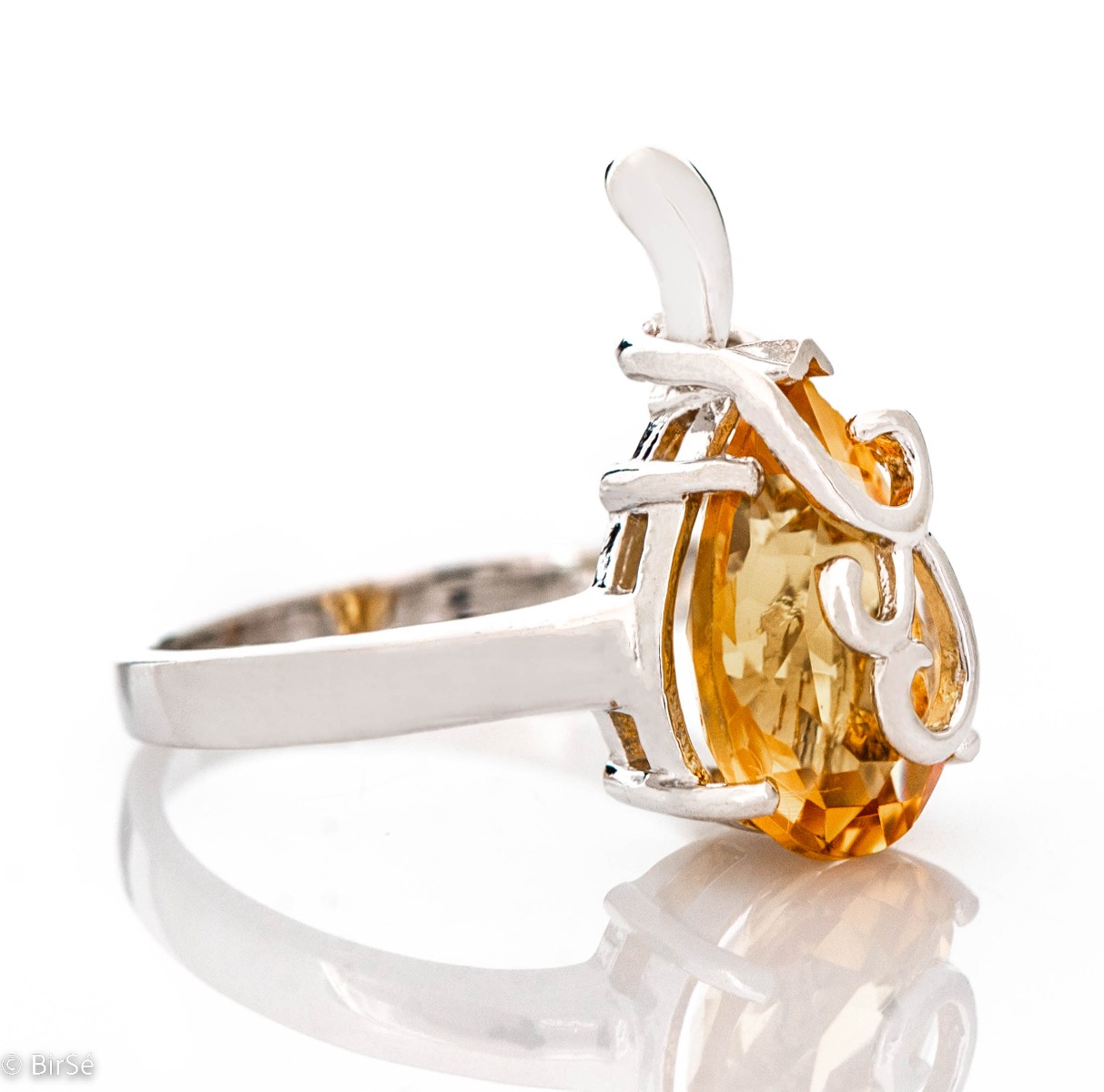 The gentle glow of a natural citrine stone, complemented by a glamorous, elegant and fine craftsmanship made entirely of beautiful rhodium silver - our new offering for women's ring, part of a charming set of pendant and dangle earrings.