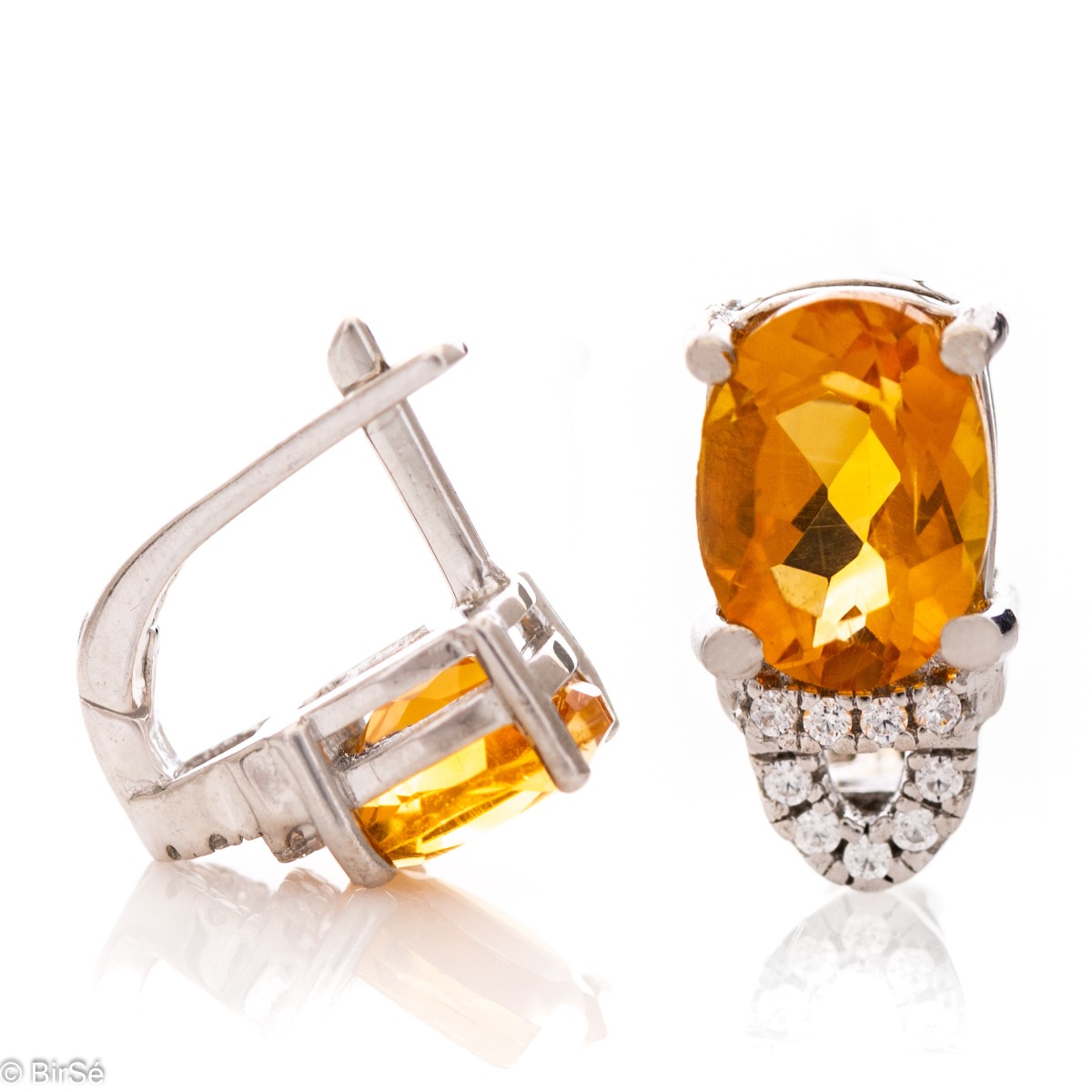 Elegant women's earrings with English clasp and radiant natural citrine, complemented by sparkling zircons and a stylish design entirely in rhodium silver.