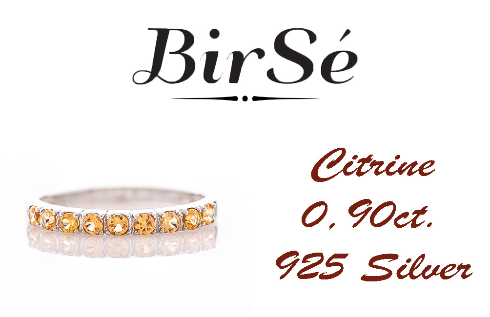 A delightfully charming ring in exquisite rhodium-plated silver with a row of enchanting citrine stones.