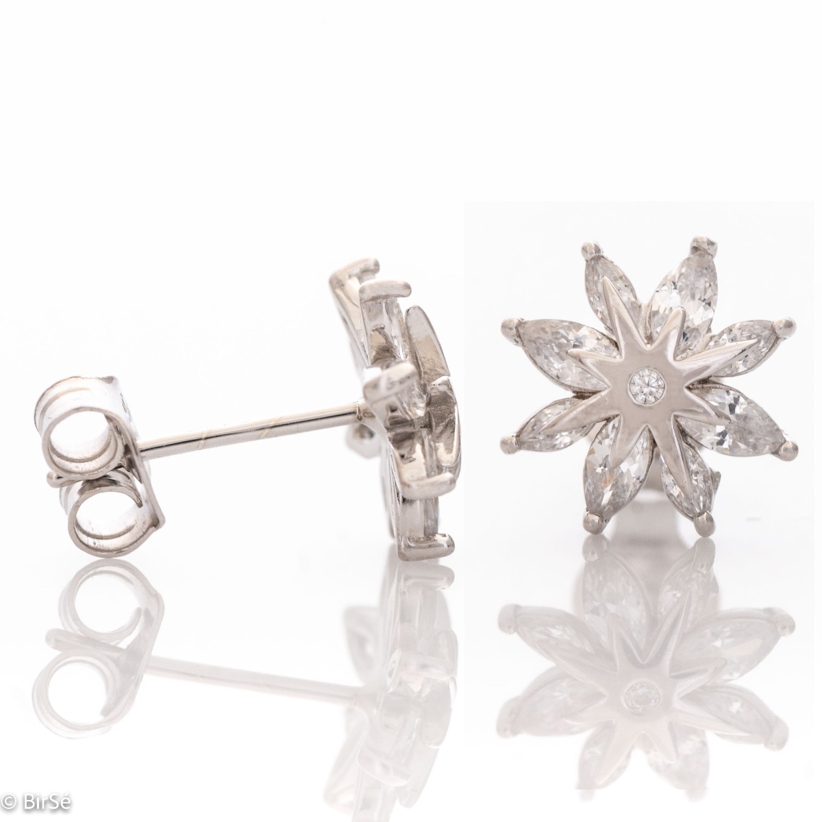 Delicate women's earrings made of fine rhodium silver, with an interesting design layout of a charming flower. Beautiful petals, exquisitely decorated with glittering zircons of different shapes, make this jewelry a suitable gift for any lady. And the pin