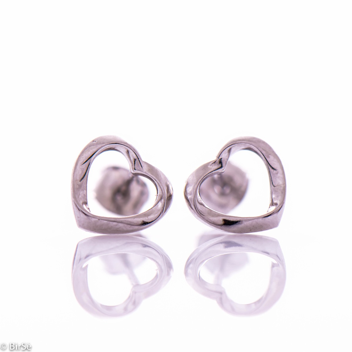 Charming rhodium silver earrings with a heart outline. The fastening is with a pin, suitable for daily use by children and ladies.