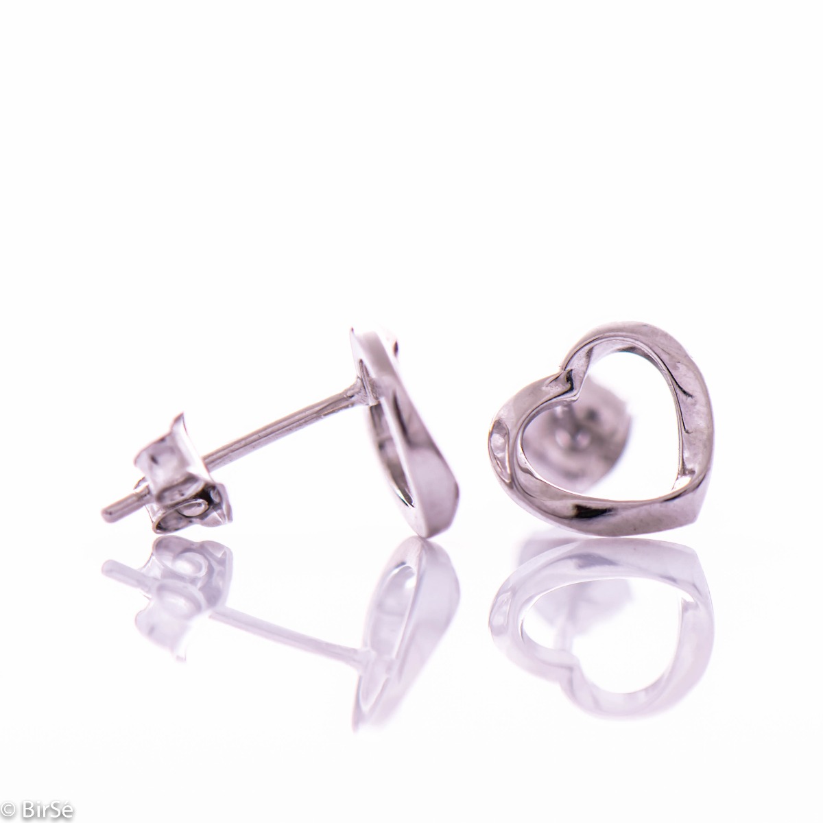 Charming rhodium silver earrings with a heart outline. The fastening is with a pin, suitable for daily use by children and ladies.