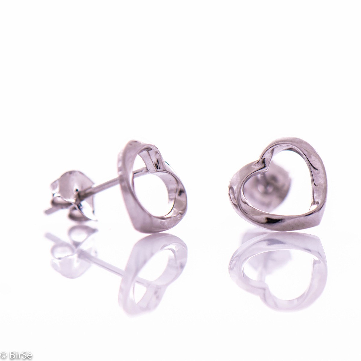 Charming rhodium silver earrings with a heart outline. The fastening is with a pin, suitable for daily use by children and ladies.