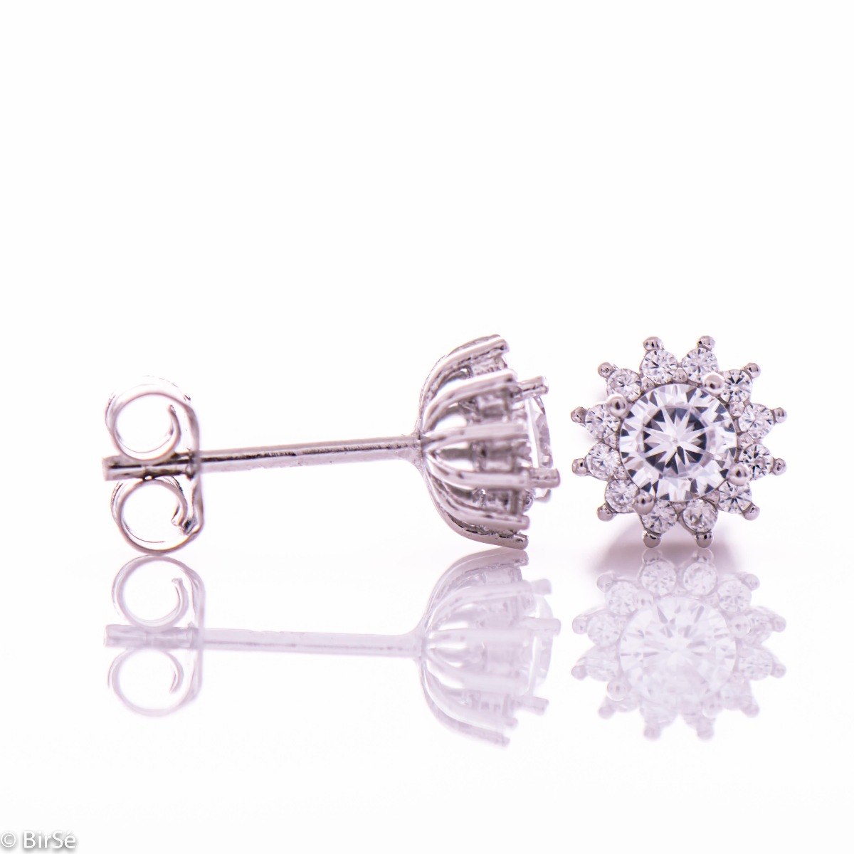 Delicate silver snowflake earrings made of rhodium silver with a captivating design. The sparkling zircons adorning the earrings turn them into a charming piece of jewelery desired by ladies.