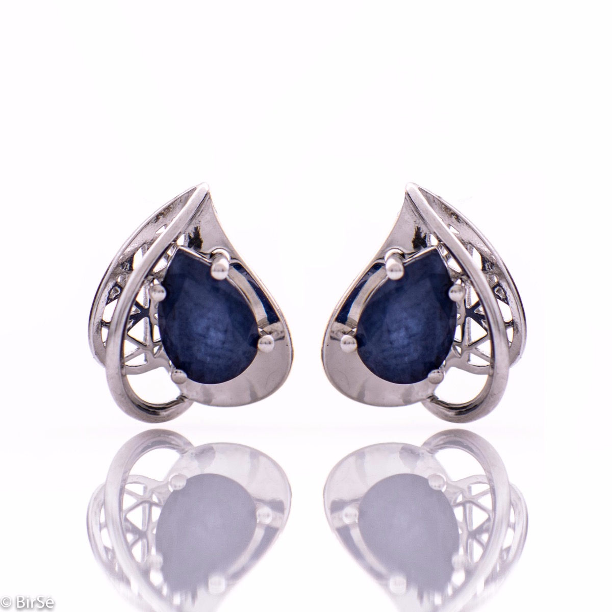 Elegant women's earrings in a modern arrangement of geometric elements and shapes, made of a stylish combination of rhodium-plated soft silver and radiant natural sapphire. Part of an exclusive set with a beautiful ring and pendant.