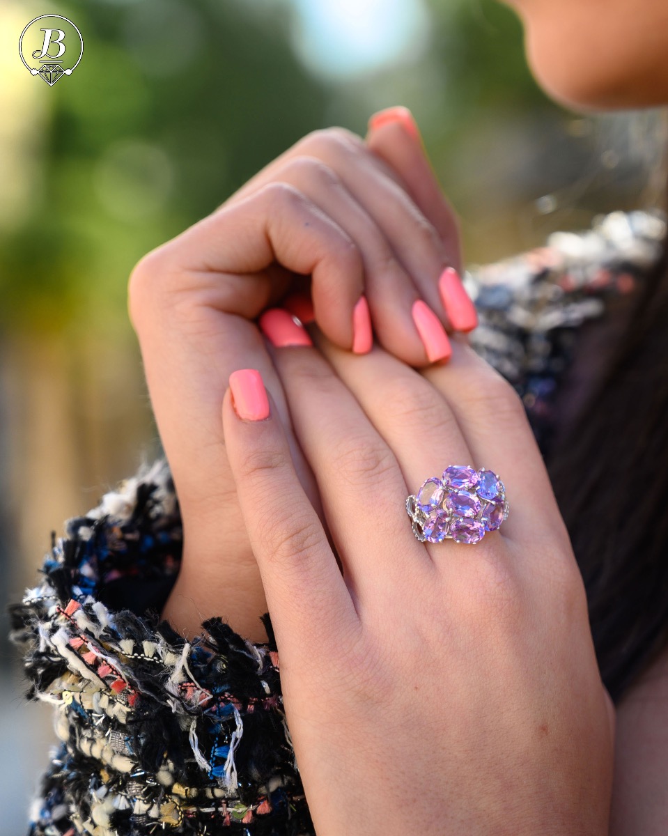 Dazzling ring with a spectacular craftsmanship entirely of rhodium-plated silver combined with a radiant natural amethyst. Part of an exclusive sterling silver three-piece set - featuring lovely earrings and a pendant.