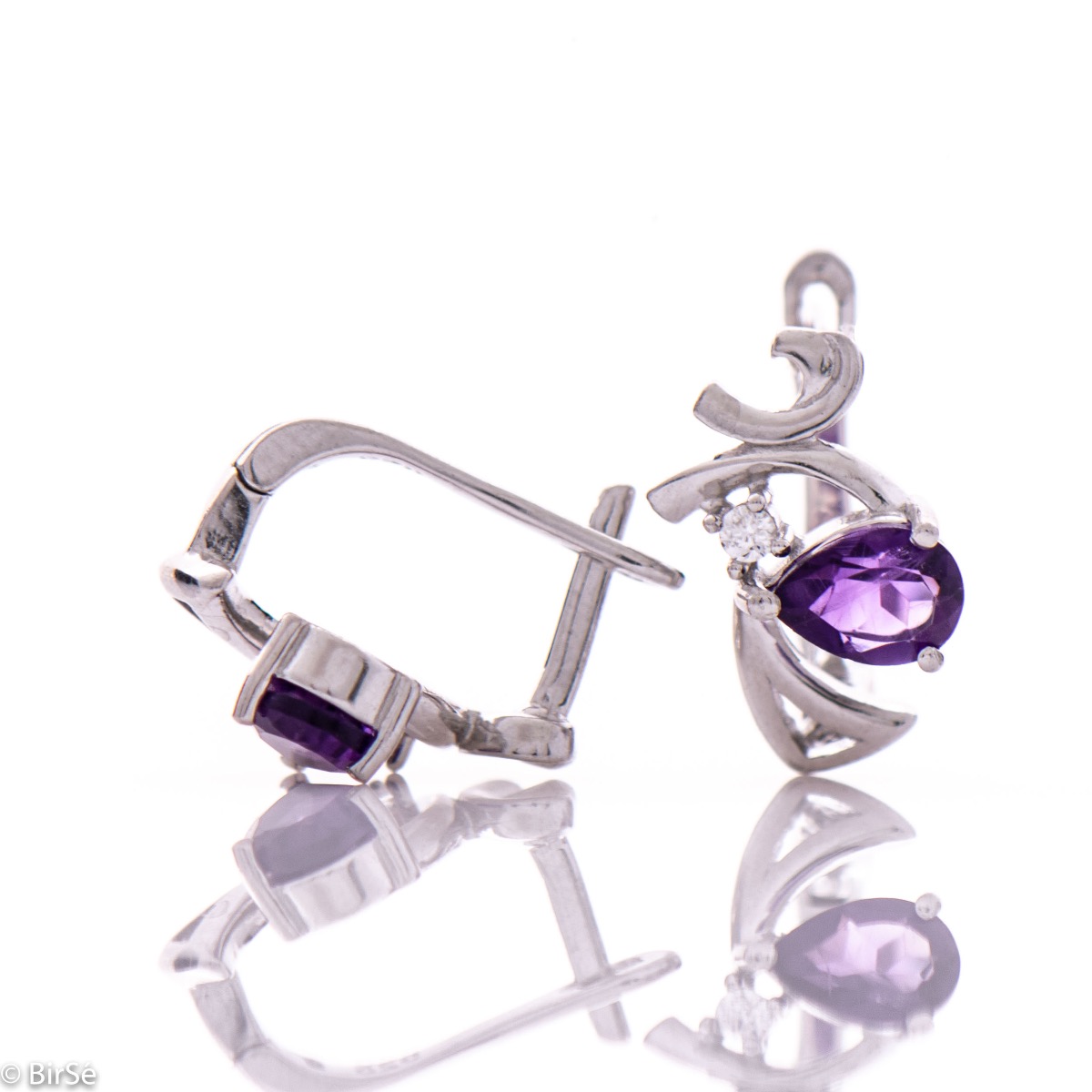 Captivating women's earrings with an English clasp and a modern design of the detail, interweaving a radiant natural amethyst stone with a delicate zircon and crafted in beautiful rhodium silver. In an exclusive ring and pendant set.