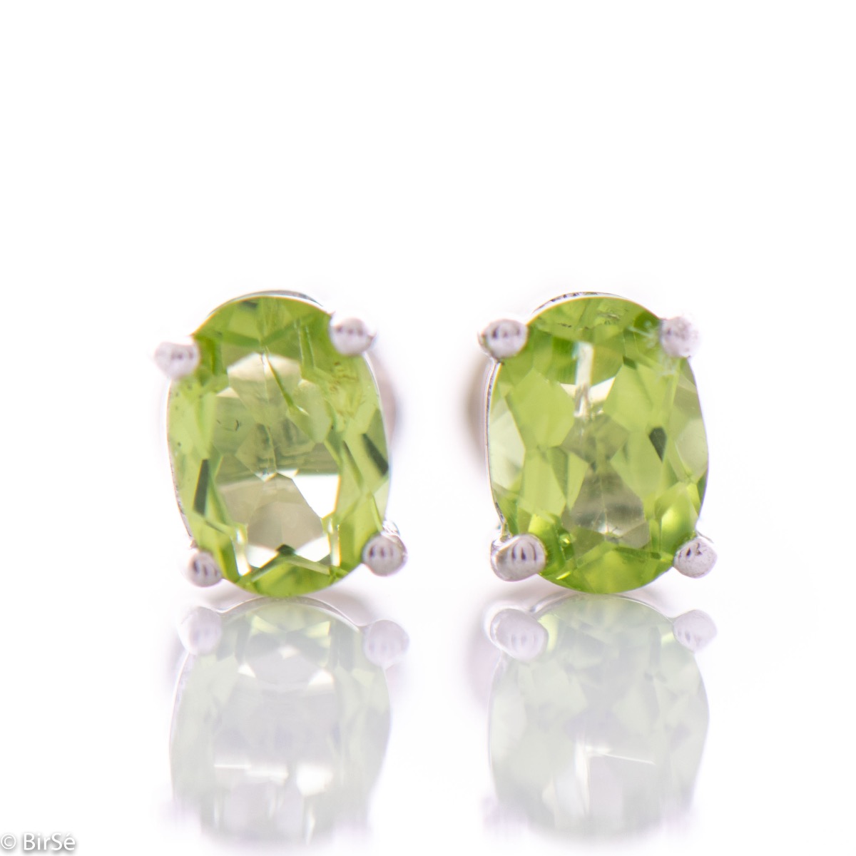 Elegant and radiant stud earrings with delicate craftsmanship, intertwining rhodium silver with the sparkle of a natural peridot stone.