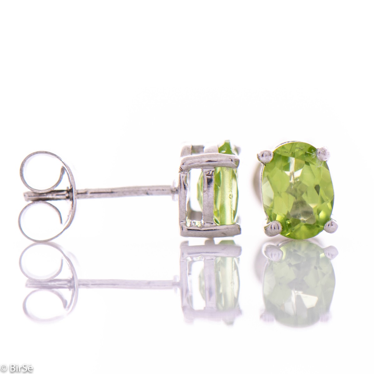 Elegant and radiant stud earrings with delicate craftsmanship, intertwining rhodium silver with the sparkle of a natural peridot stone.