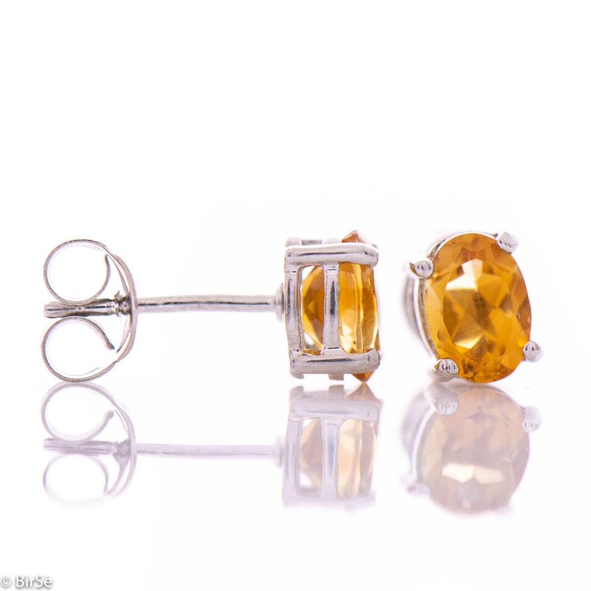 Fine craftsmanship of our new stud earrings, combining soft rhodium silver and the sparkle of natural citrine stone.