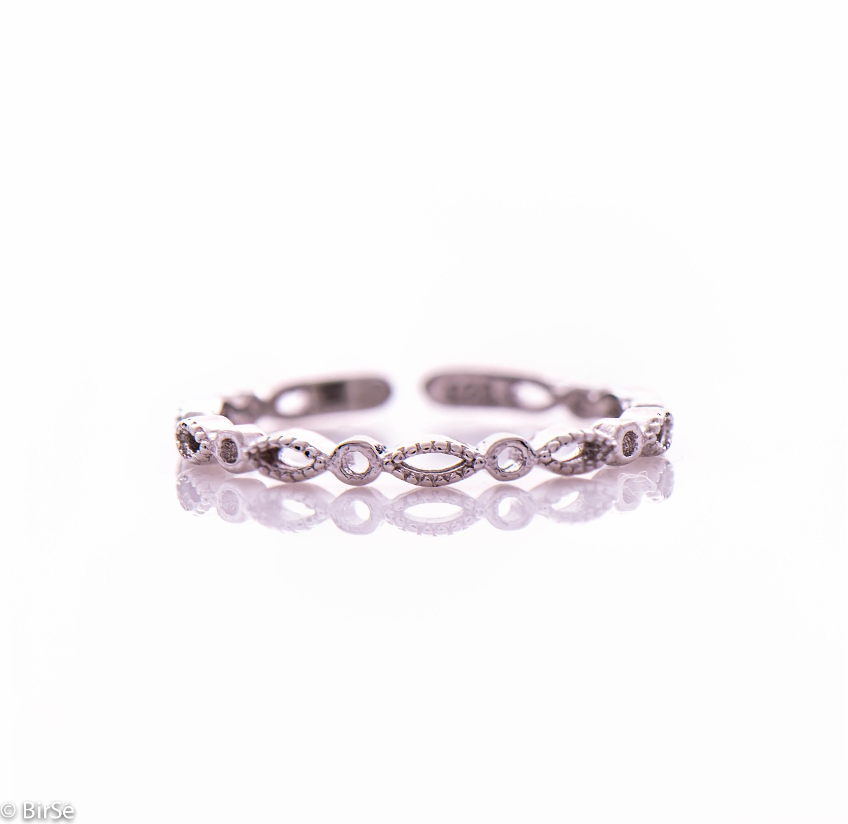 A delicate ladies' ring made entirely of rhodium-plated silver. Thanks to its stylish and slim shape, it is suitable to match with another ring next to it.