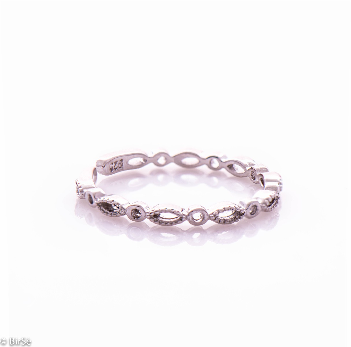 A delicate ladies' ring made entirely of rhodium-plated silver. Thanks to its stylish and slim shape, it is suitable to match with another ring next to it.