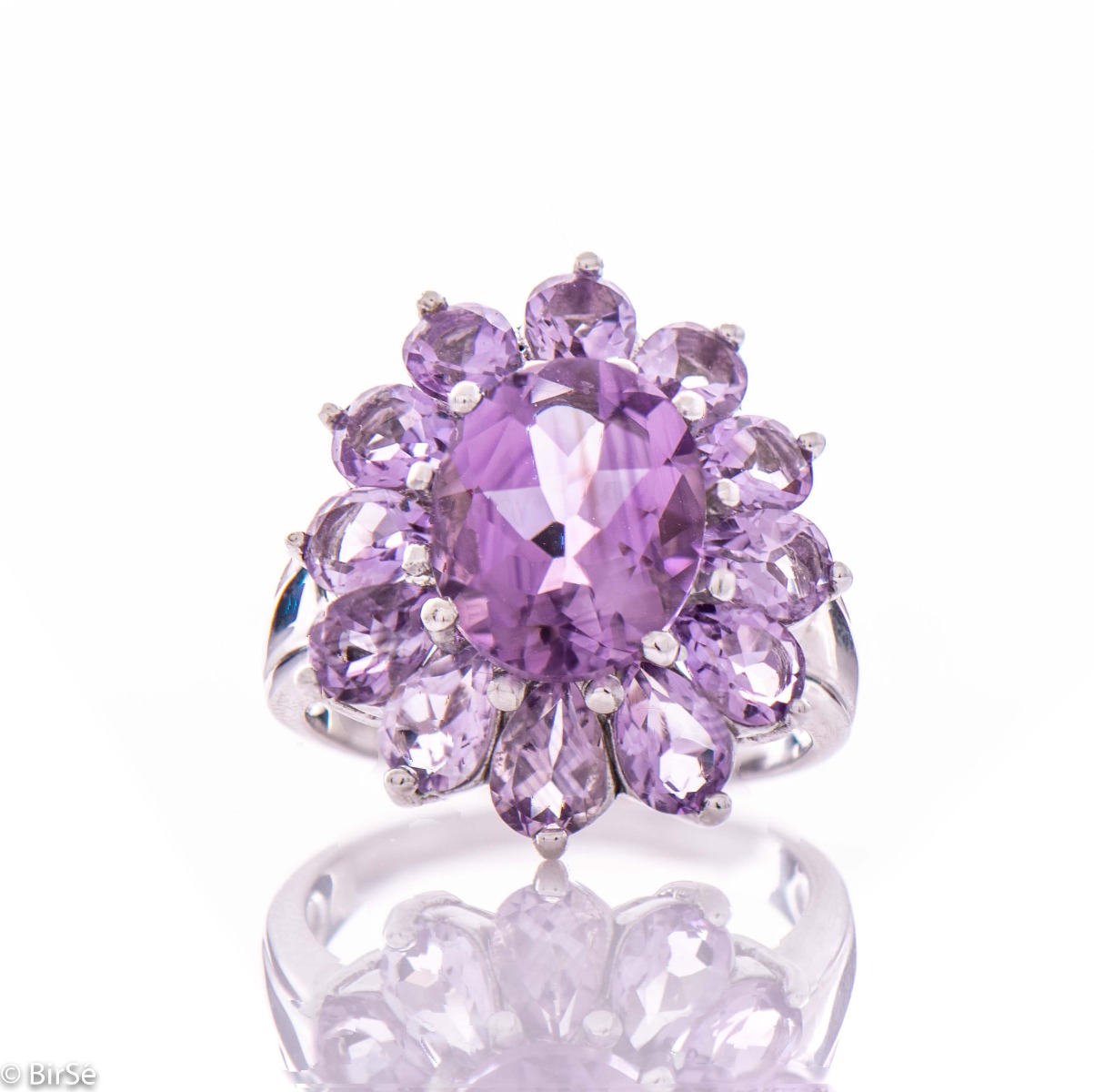 A delicate beautiful flower of natural sparkling amethysts and rhodium silver. The unique ring is suitable for ladies who prefer large jewelry. It can be combined with suitable earrings and a pendant.