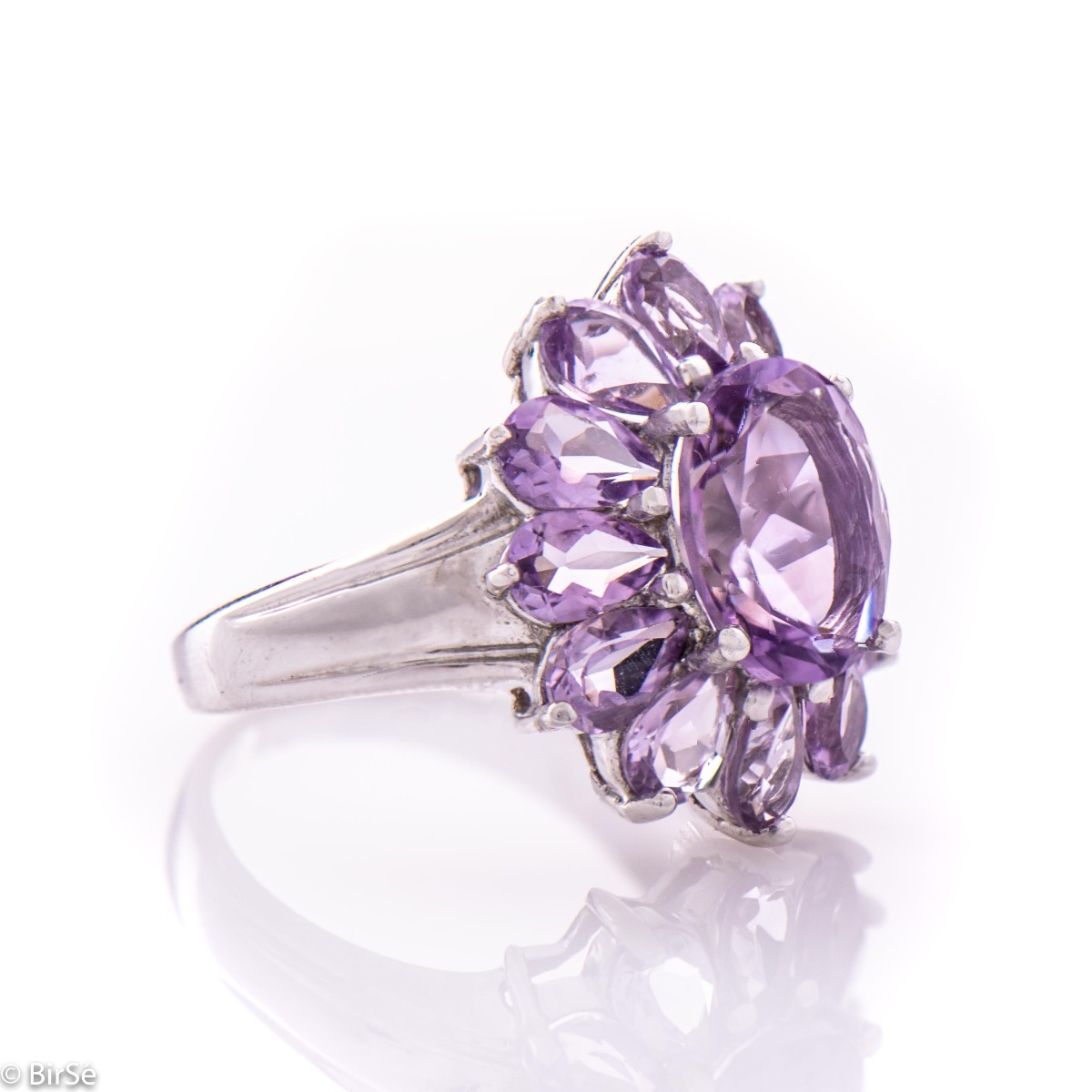 A delicate beautiful flower of natural sparkling amethysts and rhodium silver. The unique ring is suitable for ladies who prefer large jewelry. It can be combined with suitable earrings and a pendant.