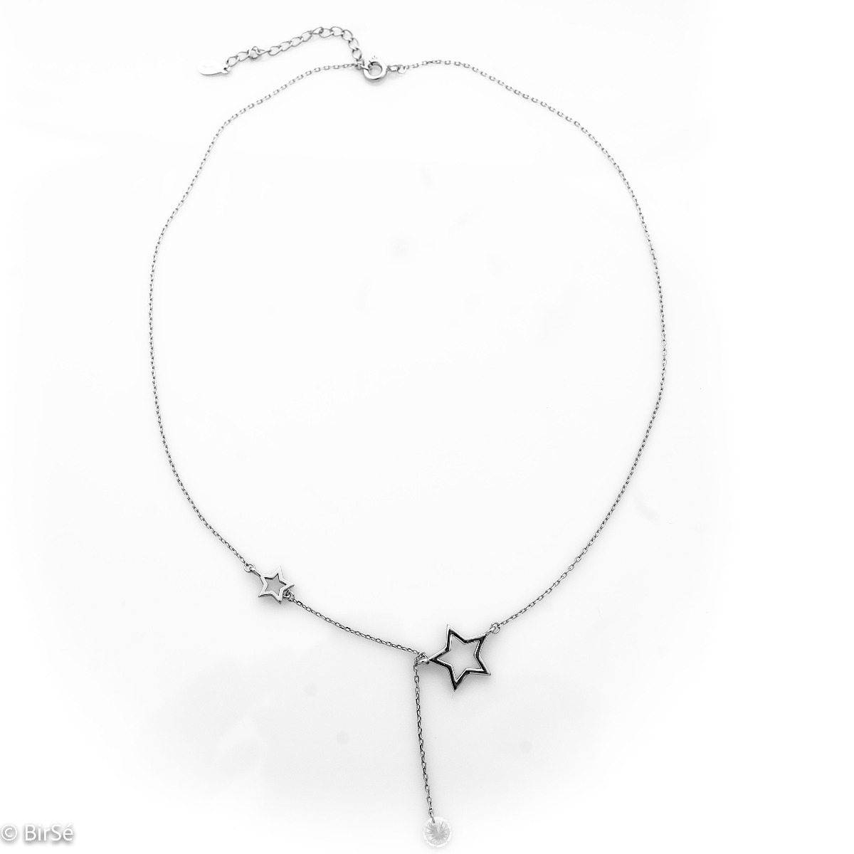 A unique silver necklace with an asymmetric placement of the details and a beautiful pendant made of master cut brilliant zircon.