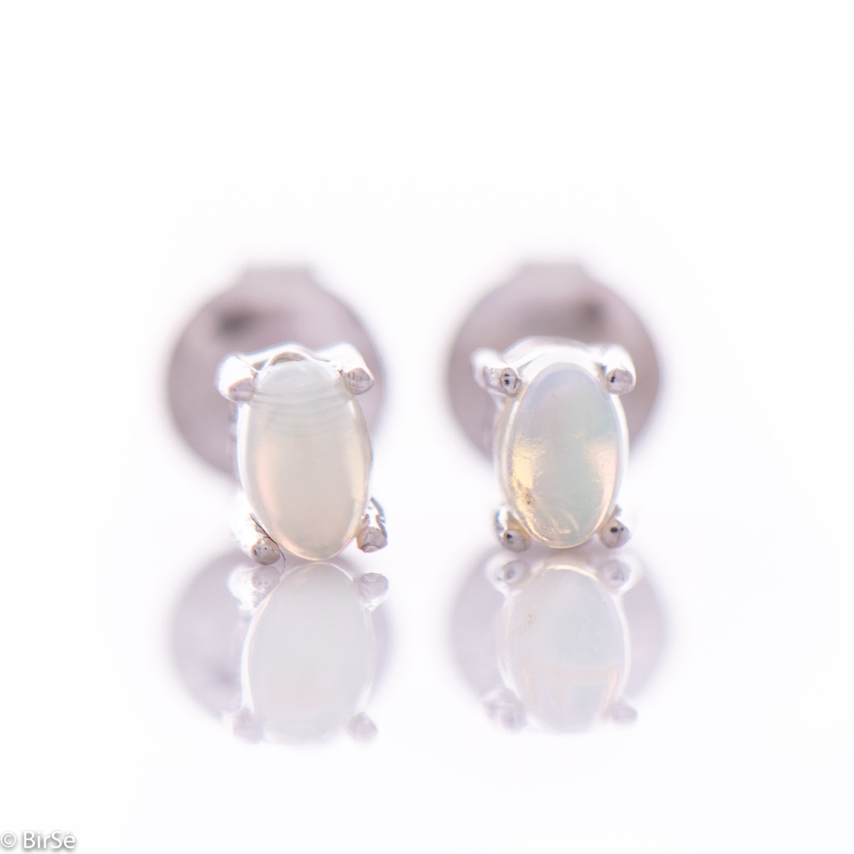 Multi-colored and radiant natural stone opal intertwined with delicate workmanship entirely of rhodium silver - our new charming stud earrings - 5x3 mm.