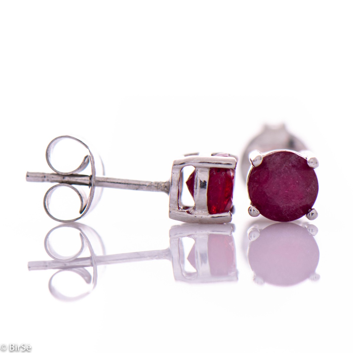 Dainty women's stud earrings in rhodium silver paired with a radiant natural ruby ​​stone for a delicate finish to any outfit.