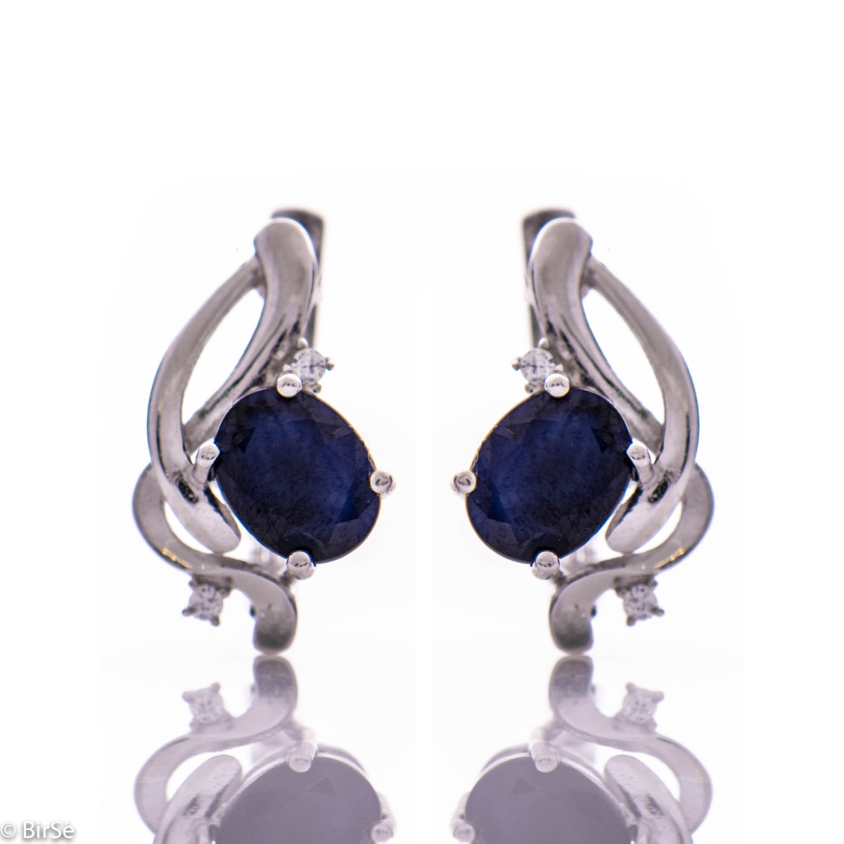 Elegant silver earrings with a gentle glow of natural sapphire and sparkling zircons.