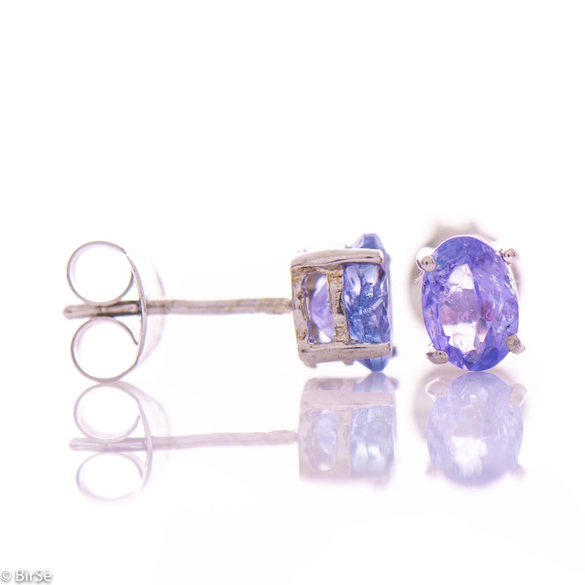 Exquisite and delicate stud earrings with a beautiful combination of natural tanzanite stone with soft rhodium silver.