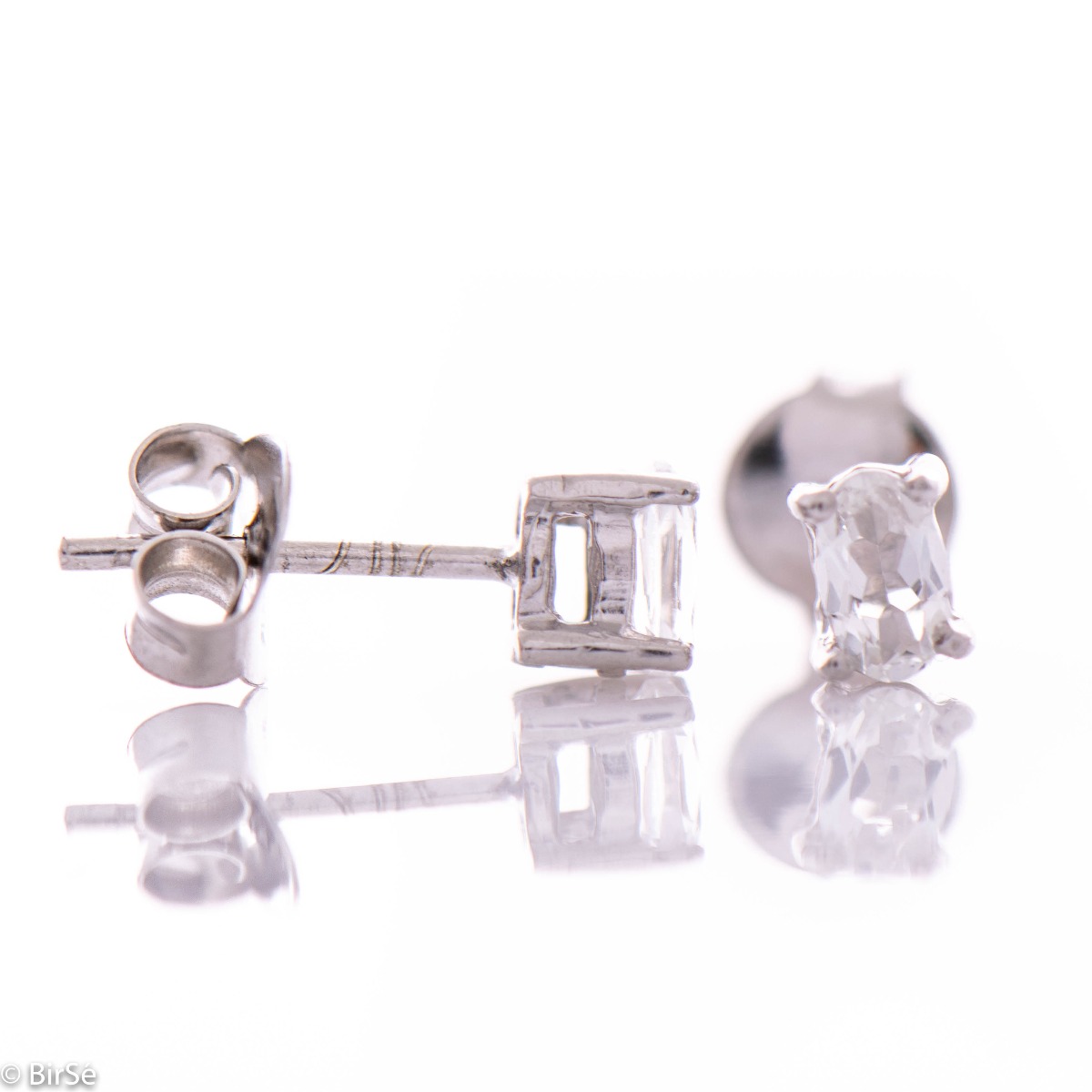 Radiant women's earrings on a pin - 5x3 mm - combining delicate rhodium-plated silver craftsmanship with the shine of a natural white topaz stone.