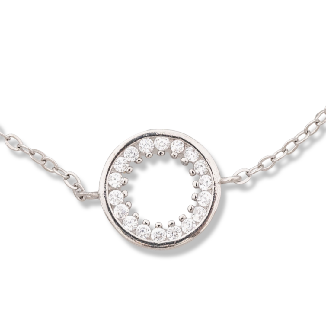 Exquisitely crafted women's bracelet, with an elegantly shaped circle of rhodium-plated silver and zircons. A perfect piece of jewelry worthy of any lady, and at the end of the chain there is a mechanism to adjust the length. The right piece of jewelery t