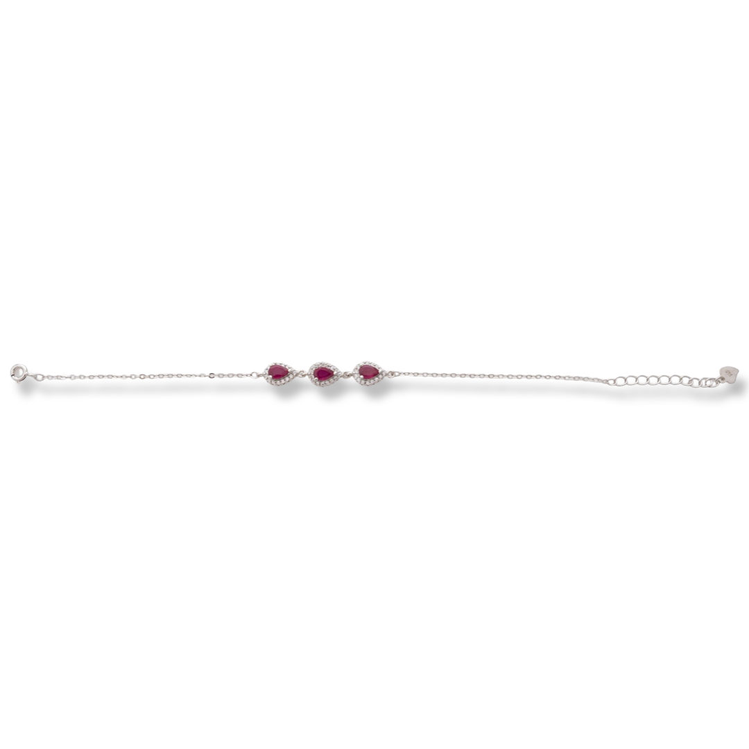 Elegant women's bracelet made of soft silver with natural ruby ​​drops, decorated with exquisite and subtle elements and sparkling zircons. The bracelet has an extension, for greater convenience when adjusting the length.