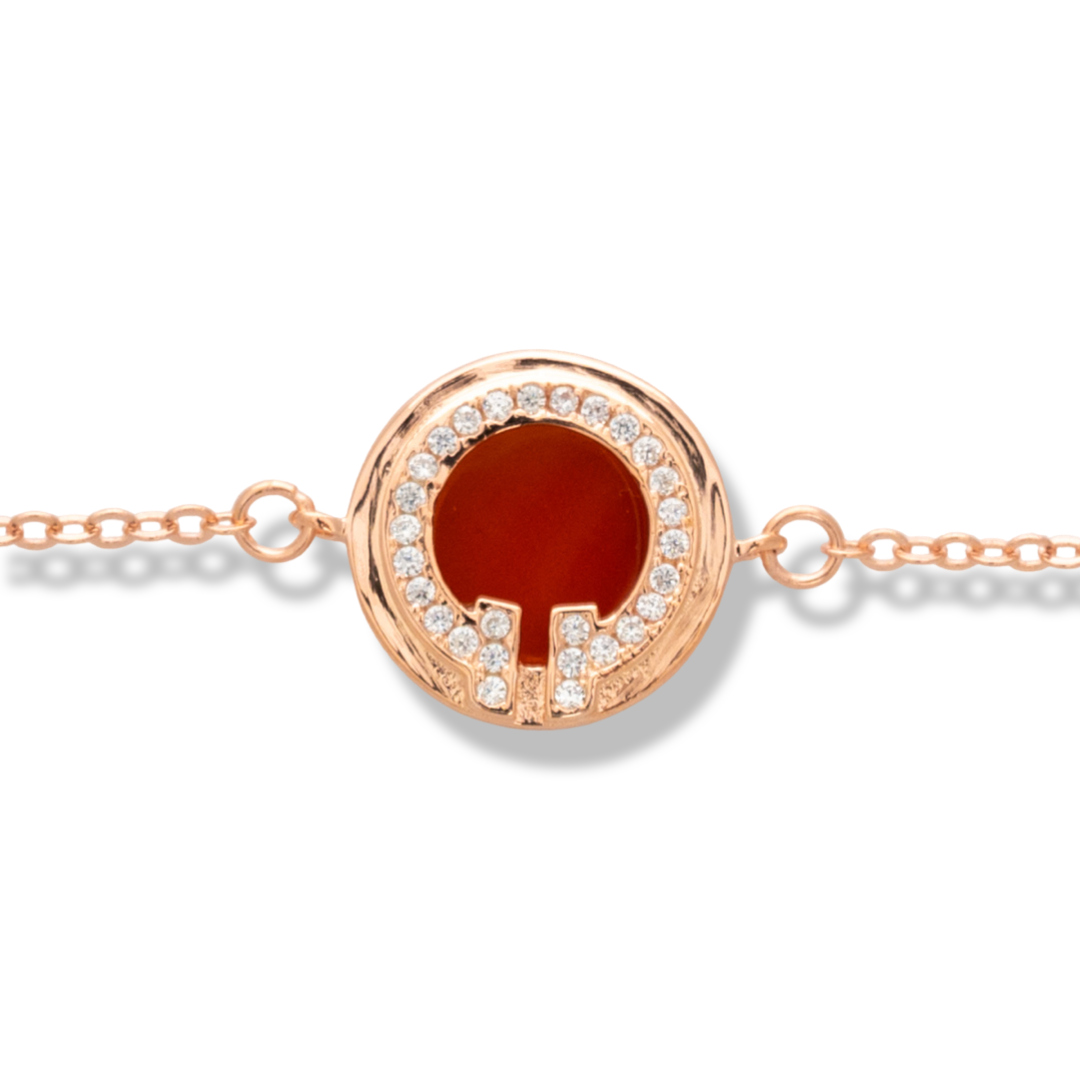 A delicately charming bracelet for stylish ladies, made entirely of beautiful rose silver, with a feature embellished with sparkling zircons and red enamel. An additional link on the chain makes it possible to adjust the size of the jewelry.