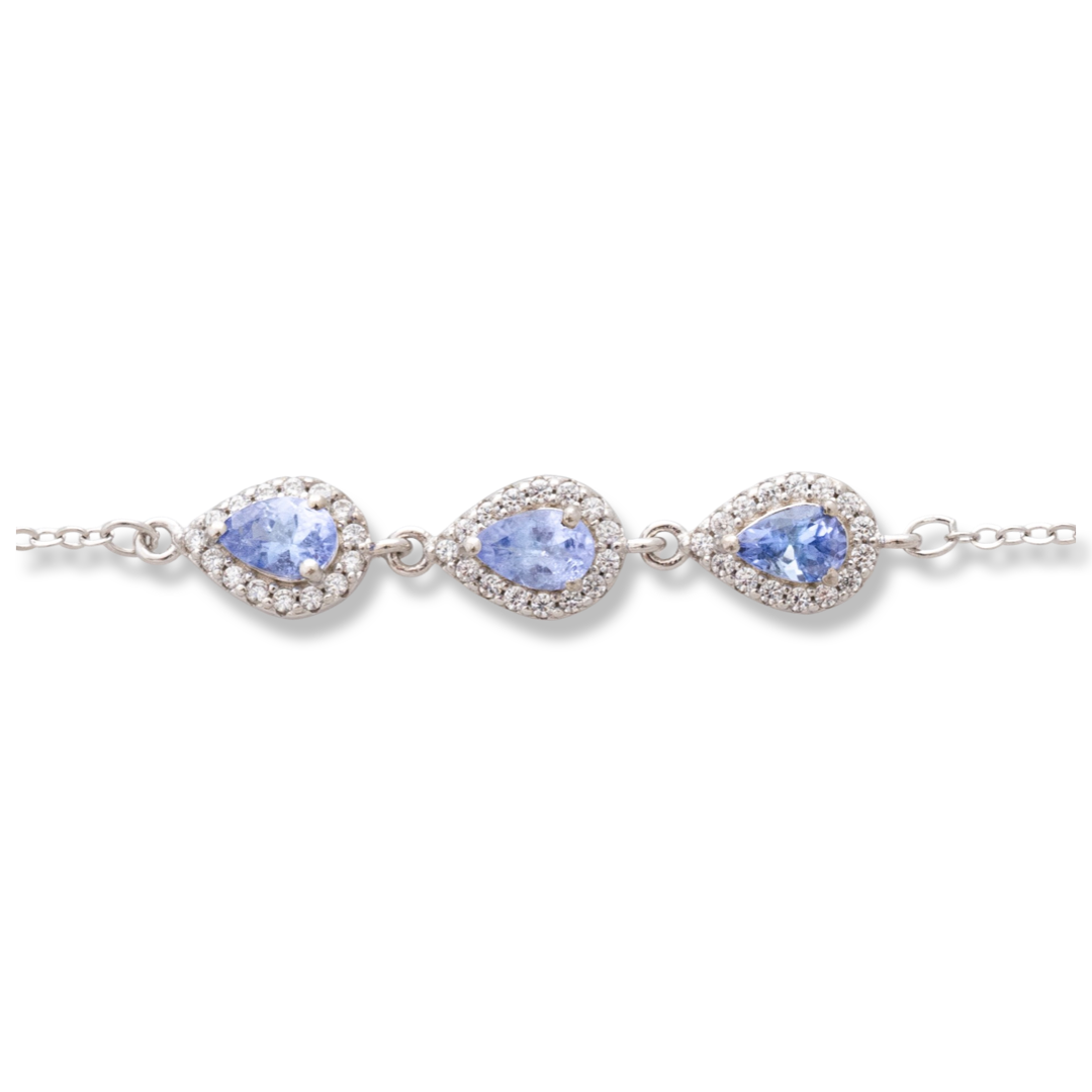 Elegant women's bracelet in soft silver with natural tanzanite drops, decorated with exquisite and subtle elements and sparkling zircons. The bracelet has an extension, for greater convenience when adjusting the length.