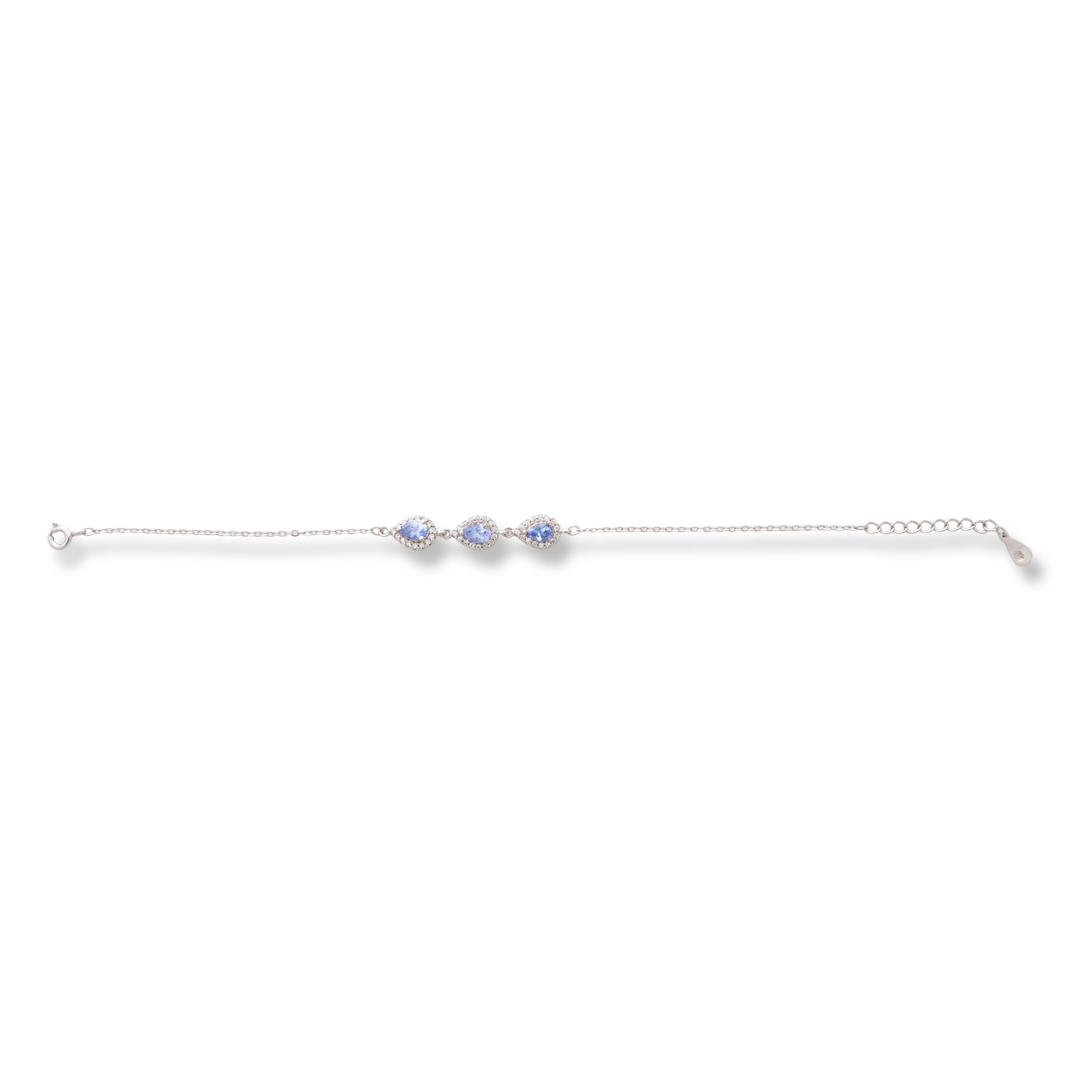 Elegant women's bracelet in soft silver with natural tanzanite drops, decorated with exquisite and subtle elements and sparkling zircons. The bracelet has an extension, for greater convenience when adjusting the length.