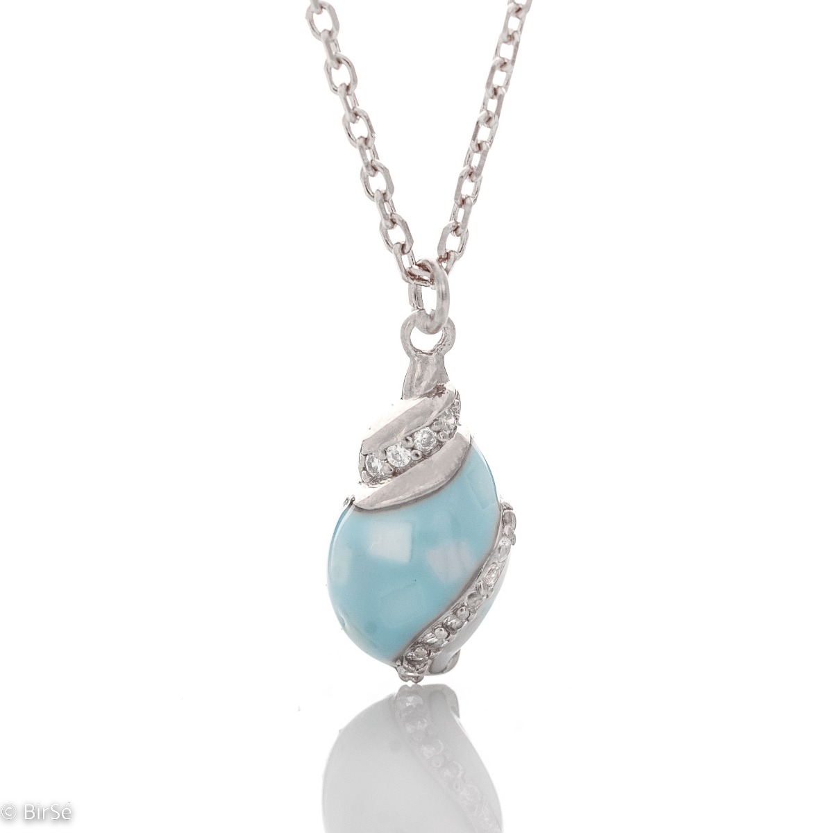 Delicate women's necklace with an exquisite rhodium silver pendant design. The jewelry features an elegant chain holding an exotic element with a captivating sea blue opal and added fine zircons.