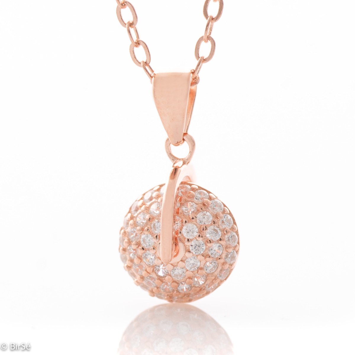 Extravagant necklace in rose silver with an interesting spinning element resembling a wheel. Abundantly adorned with glittering zircons, it adds charm to the jewelry and beautiful reflections when meeting the sun.