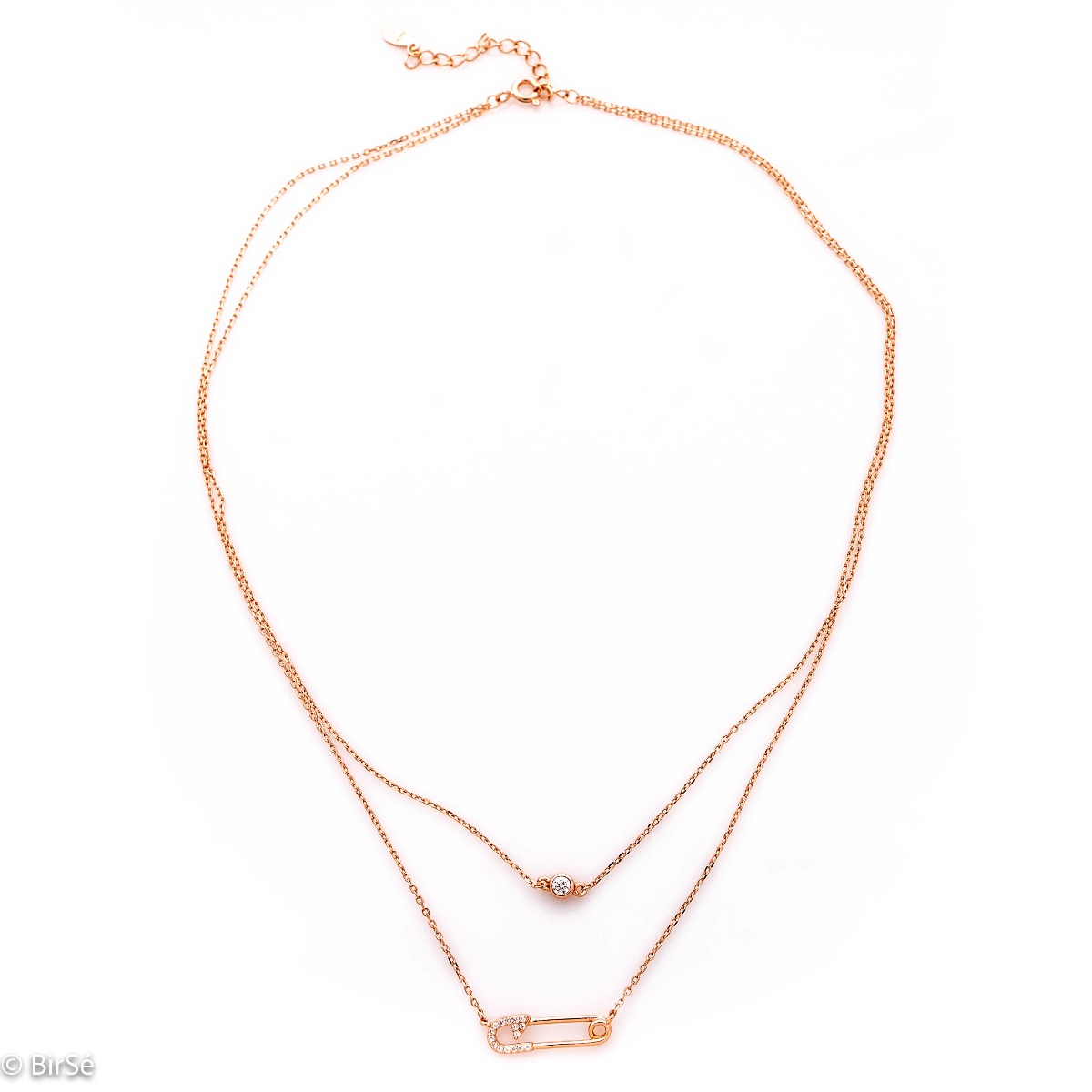 Elegant and trendy rose silver necklace in the shape of a safety pin encrusted with zircons. There is a small fine zircon on the second, shorter chain of the necklace.