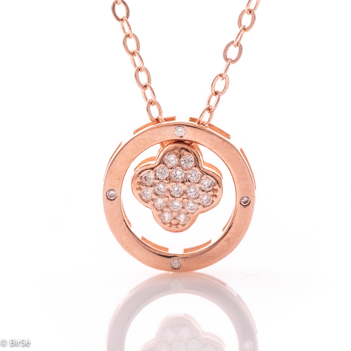 A charming women's necklace with a circle of soft rose silver and a clover covered in all zircons that moves freely along the chain.