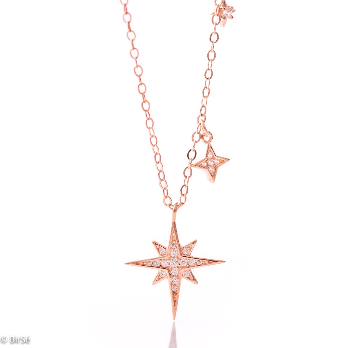 A charming women's necklace in soft pink silver with exquisitely crafted star pendants, asymmetrically placed on one side of the chain.