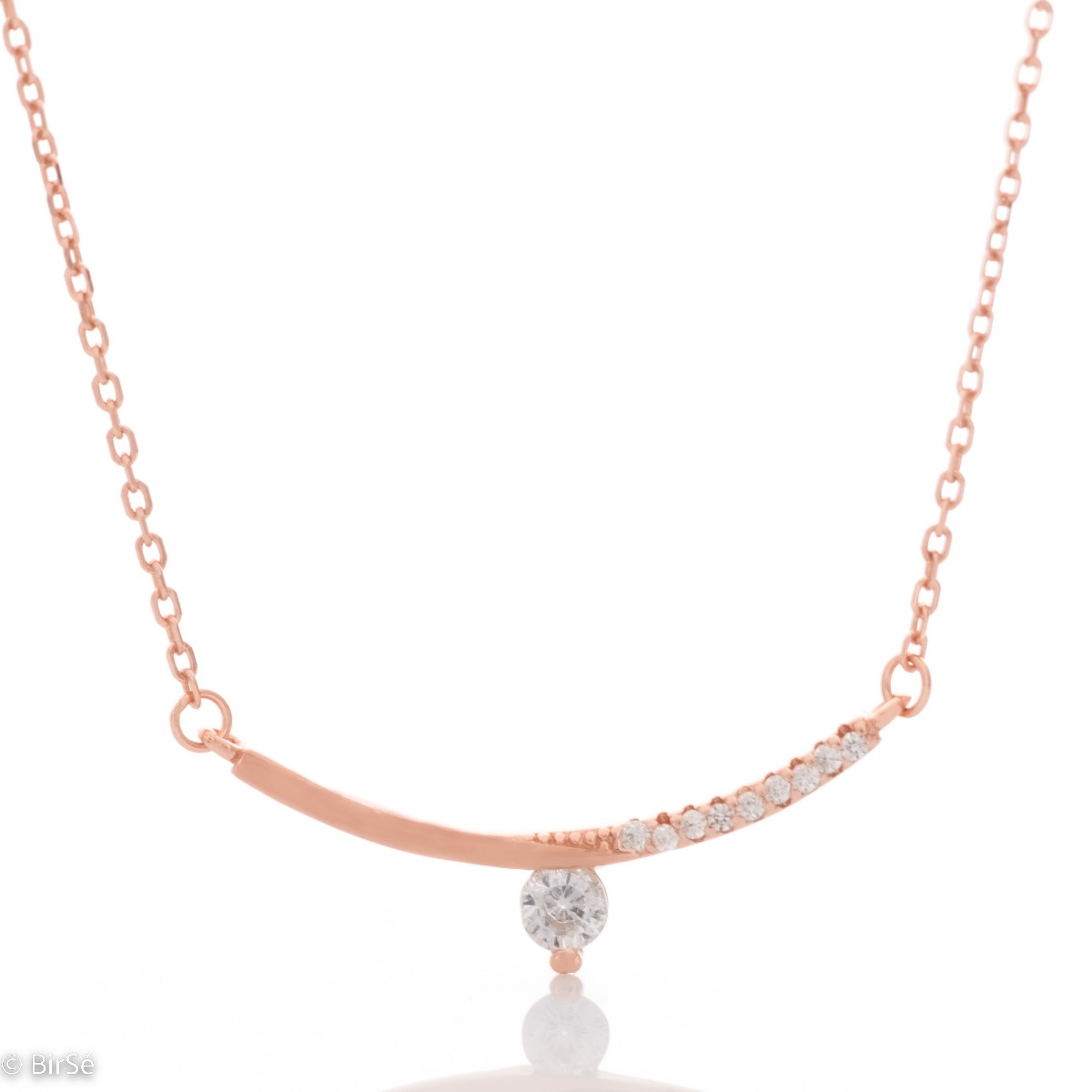 Stylish women's necklace with an exquisite design in rose silver. The piece of jewelry is charmingly crafted - a delicate chain holding a fine element, elegantly decorated with glittering zircons.