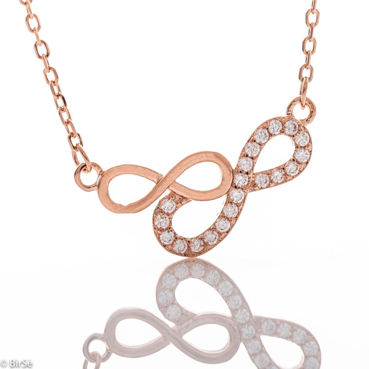 An elegant women's necklace in the shape of gentle infinities, complemented by sparkling zircons and made entirely of spectacular rhodium-plated rose silver.