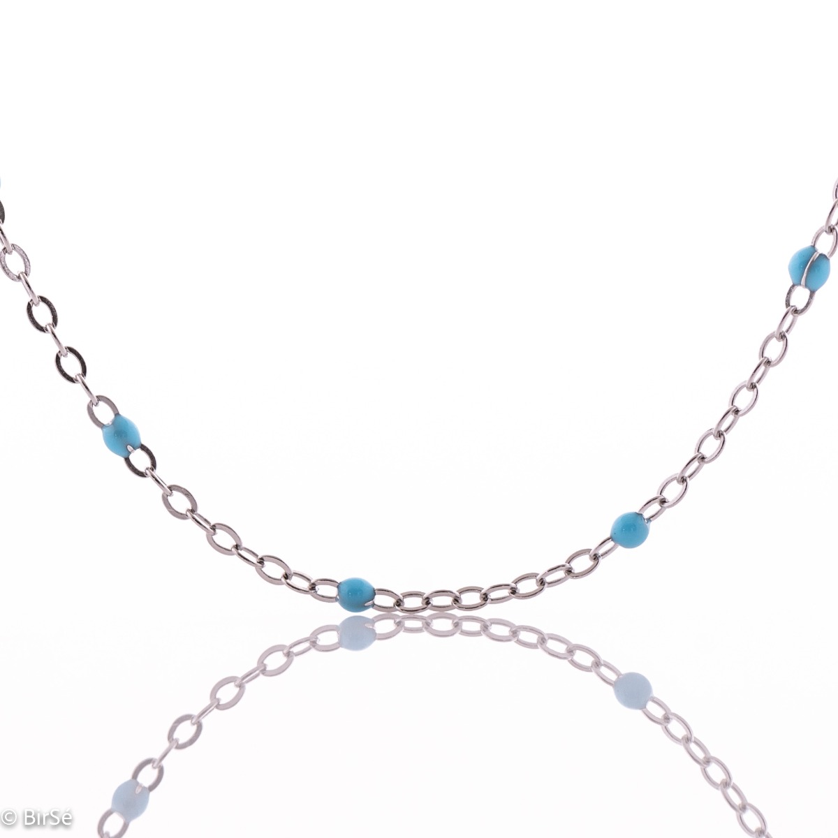 Delightfully delicate women's necklace in fine rhodium silver and delicate blue turquoise beads that add an exotic nautical flavor to the jewelry. Can be combined with a matching bracelet with the same turquoise elements.