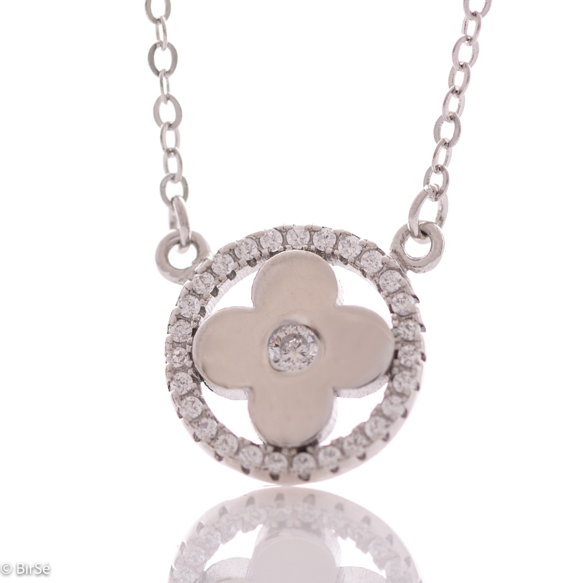 Delicate women's necklace with an exquisitely beautiful flower, made entirely of rhodium-plated silver and placed in the middle of a silver ring encrusted with sparkling zircons.