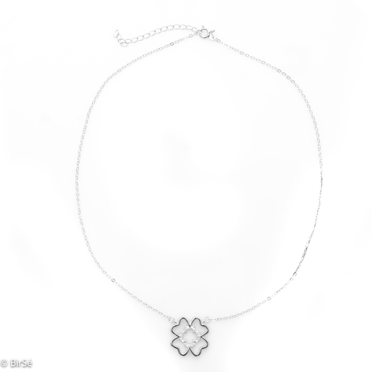 Fine silver clover necklace. Beautifully crafted in rhodium silver, it gently wraps around a fine four-leaf clover, fully embellished with cubic zirconia. The chain is delicate, with an extender to be worn according to the lady's preference.