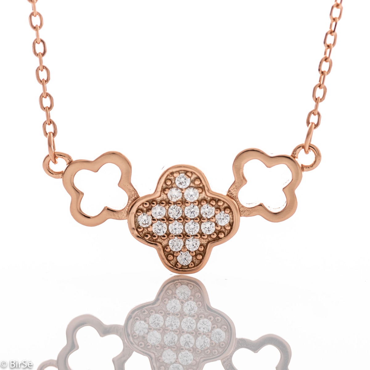 Fine women's necklace with clean shapes and delicate clovers. The softness of the rose silver and the discreet shine of the zircons give the necklace a special charm.