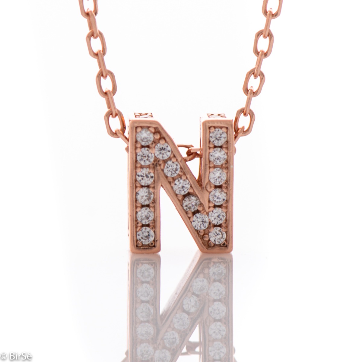 Finely crafted rose silver letter N necklace for women, all encrusted with glittering zircons. An attractive piece of jewelry in which the delicate beauty of rose silver is skilfully combined with the brilliance of zircons.