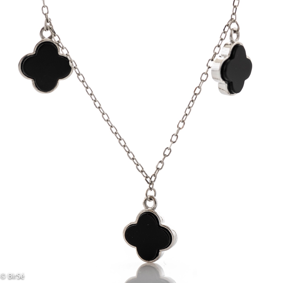 Exquisitely crafted women's necklace from fine rhodium silver, with beautifully shaped charms - clovers from magical onyx. The jewelry is suitable for any lady's casual or formal outfit.